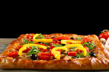 Freshly homemade pizza on black background