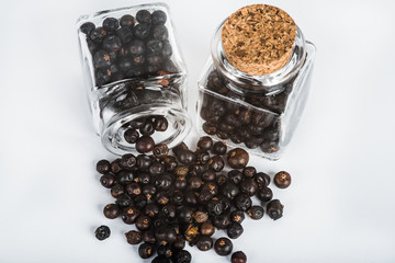 Fototapeta na wymiar Wooden scoop with dried juniper berries