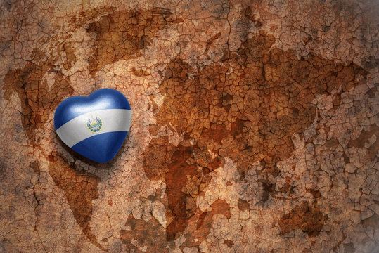 heart with national flag of el salvador on a vintage world map crack paper background. concept