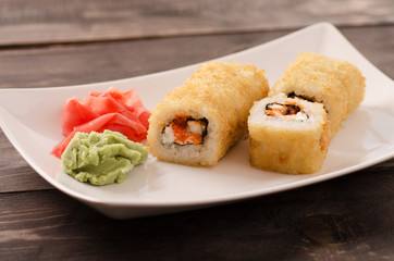 Japanese seafood sushi, roll on a white plate