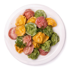 Freshly made dumplings stuffed with meat on a white background
