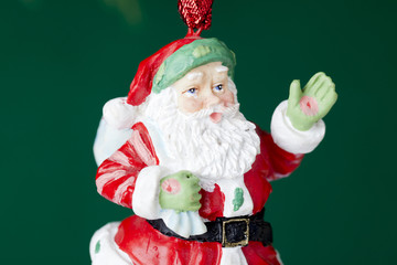 close-up of a santa claus hanging on a christmas tree.