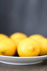 Lemons in a dish with a simple background