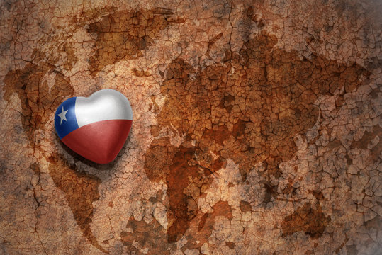 heart with national flag of chile on a vintage world map crack paper background. concept
