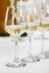 Glasses of white wine on table closeup