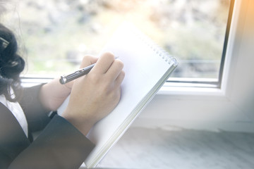 Naklejka premium Business woman taking notes.