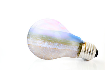 Light bulb / Light bulb with beach on white background. Nature concept.