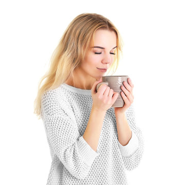 Beautiful girl enjoying a cup of tea, isolated on white
