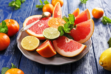 Juicy composition of tropical fruits in a bowl, close up