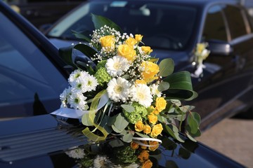Luxury wedding car decorated with flowers