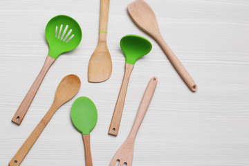 Set of wooden kitchen utensils on a table