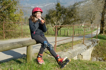 preteen in roller skate, eat an apple