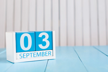 September 3rd. Image of september 3 wooden color calendar on white background. Autumn day. Empty space for text