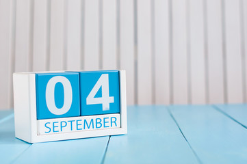 September 4th. Image of september 4 wooden color calendar on white background. Autumn day. Empty space for text