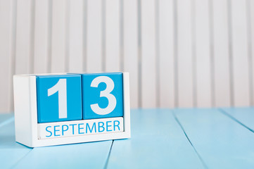 September 13th. Image of september 13 wooden color calendar on white background. Autumn day. Empty...