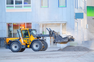 Stockholm, Sweden - March, 16, 2016: autoloader works on a street of Stockholm, Sweden