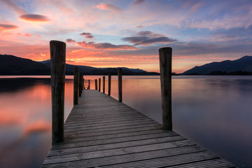 Ashness Jetty with a stunning spring sunset over Derwentwater in the Lake District, UK.