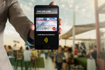 Woman paying by credit card, via mobile app.