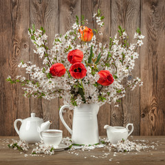 Tulips and cherry blossom on a decorated table