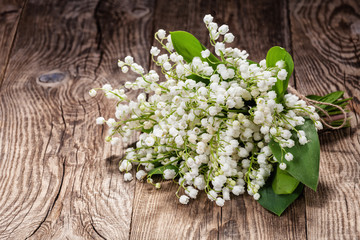 Lilies of the valley on old board