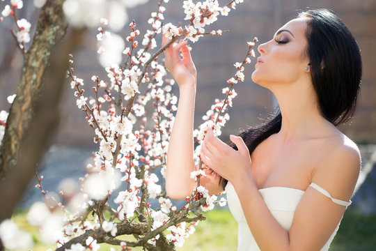 Sensual girl with blooming flowers