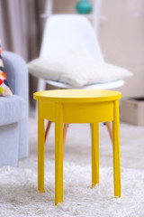Vivid home interior with yellow coffee table and decorations