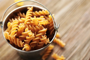 Uncooked pasta in buckets, closeup