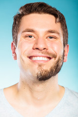 Obraz premium Happy man with half shaved face beard hair.