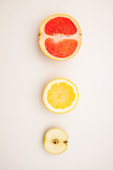 cut grapefruit and lemon apple