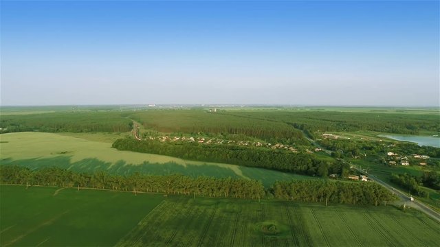 Aerial shot: Flying over fields
