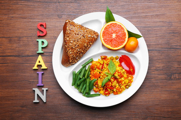 Traditional Spanish lunch on wooden background