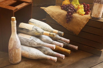 Aged wine bottles in a wine cellar