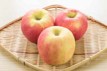 Red apple in basket