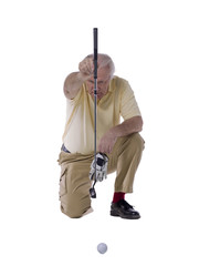 matured man playing golf