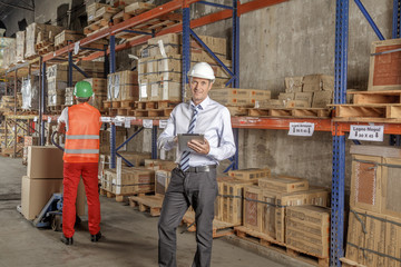 Fototapeta premium Workers In Warehouse Preparing Goods For shipping