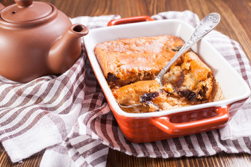 cottage cheese casserole with dried fruits in a dish, selective focus