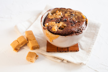 chocolate cake in a cup on a table, selective focus