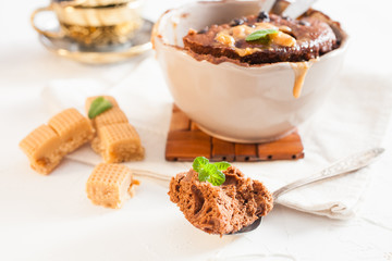 chocolate cake in a cup on a table, selective focus