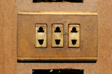 Old dirty wall plug in a derelict building for recycle