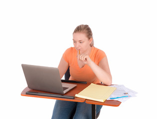 Young college student working on laptop computer