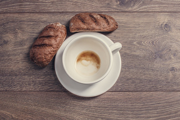Bread and empy coffee cup.