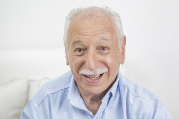 Fototapeta na wymiar Smiling elderly man