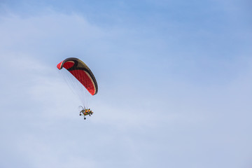 Motor glider high up in the sky