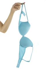 Woman's hand holding a turquoise bra by the strap with one figure. Shot on a white background