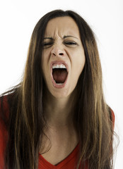 Angry woman look looking at camera and yelling, Shot on a white background.
