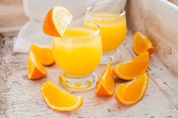 orange juice on an old shabby background, selective focus