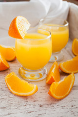 orange juice on an old shabby background, selective focus