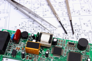 Printed circuit board and precision tools on diagram of electronics, technology