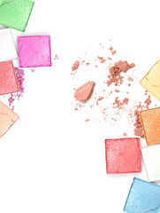 Colorful Decorative cosmetics on white concrete floor workplace. Top view