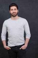 Cheerful young man with copy space and looking at camera with sm